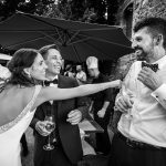 grayscale photo of man and woman kissing